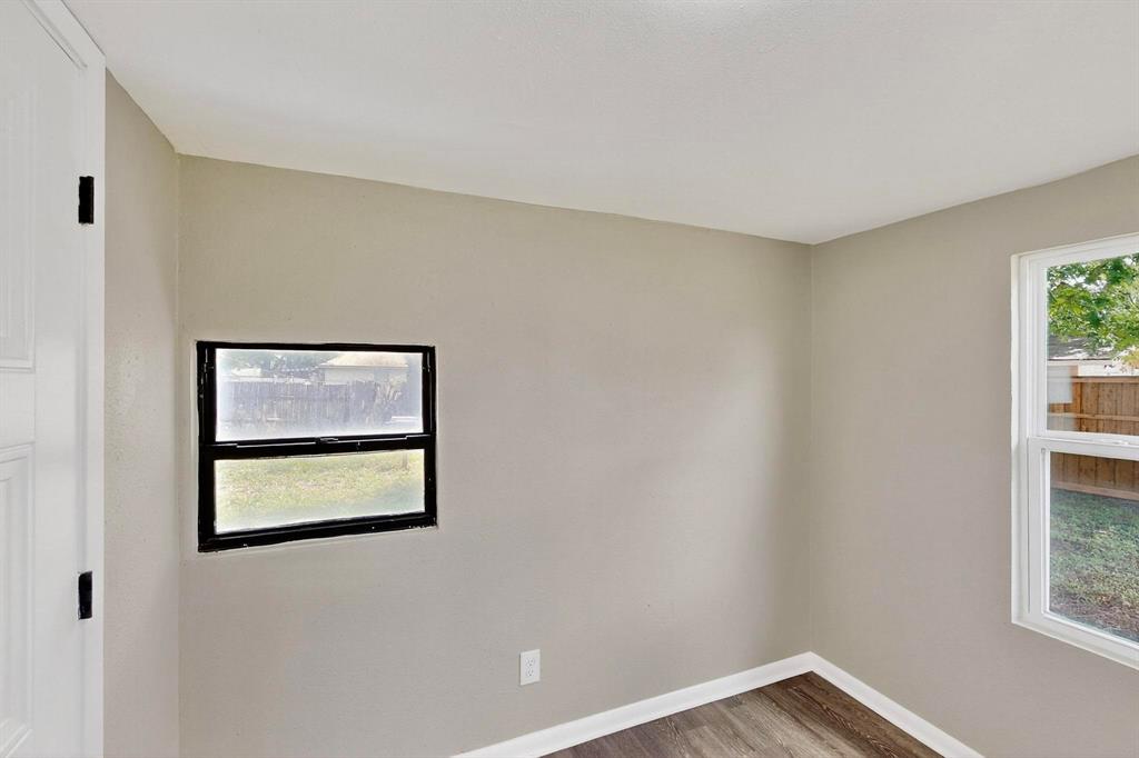 3112 Red River Street Melissa, TX 75454 - Photo 24 of 40 Unfurnished room featuring baseboards and wood finished floors