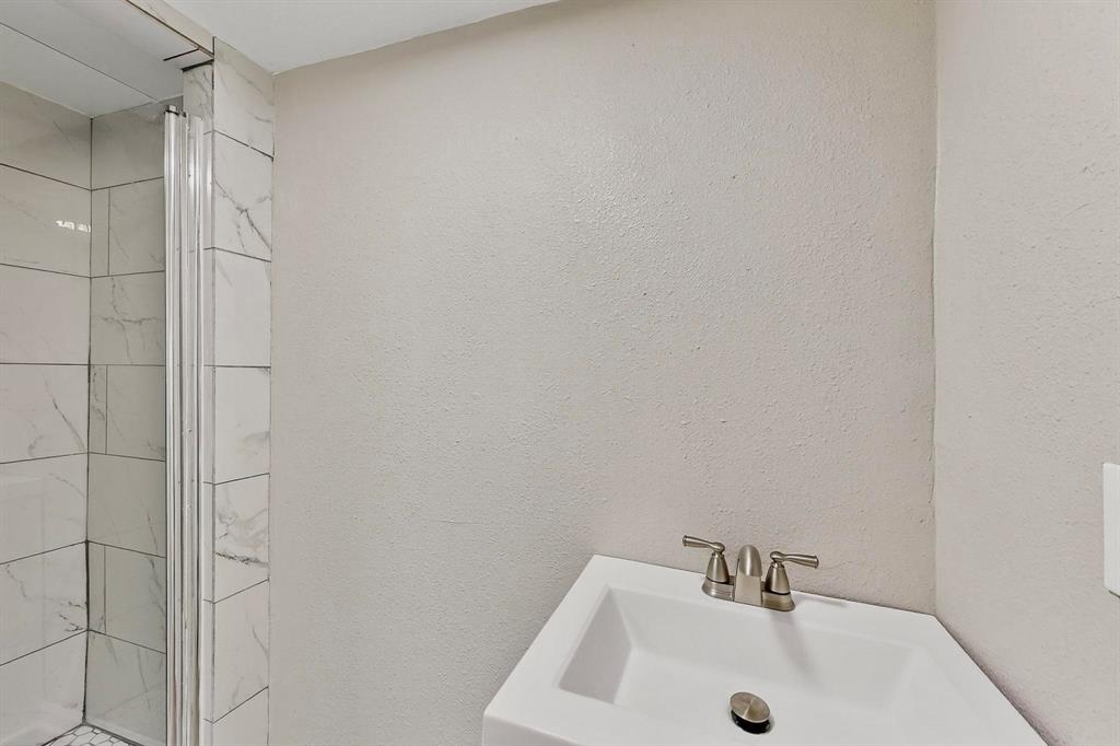 3112 Red River Street Melissa, TX 75454 - Photo 25 of 40 Bathroom with a sink and a shower