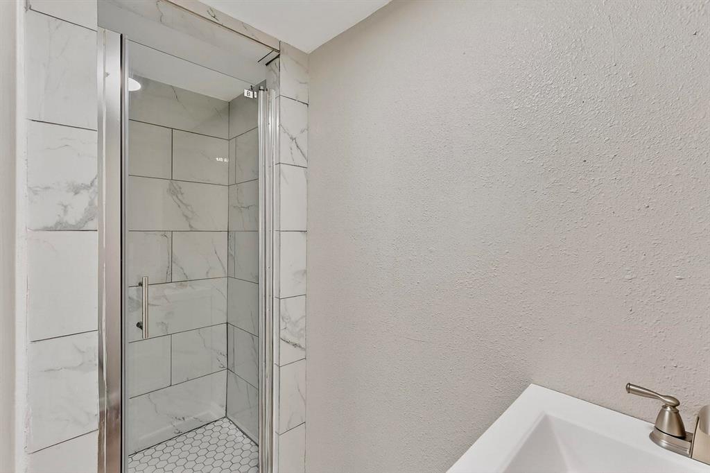 3112 Red River Street Melissa, TX 75454 - Photo 26 of 40 Bathroom featuring a marble finish shower and a sink