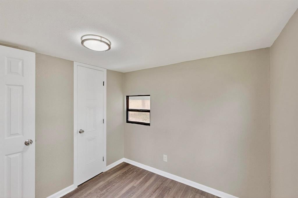 3112 Red River Street Melissa, TX 75454 - Photo 28 of 40 Unfurnished bedroom with light wood finished floors and baseboards