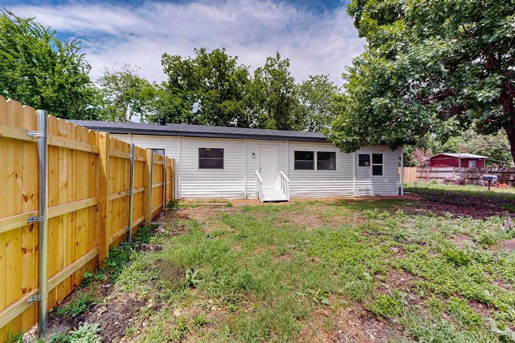 3112 Red River Street Melissa, TX 75454 - Photo 9 of 40 Rear view of house with a fenced backyard and entry steps