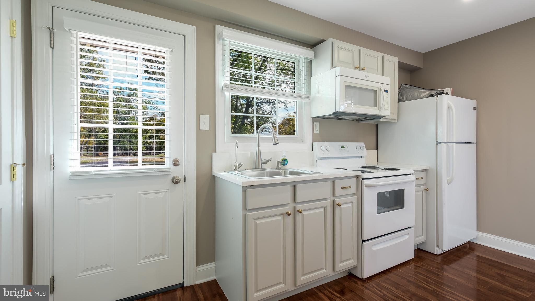 1732 Creek Road New Hope, PA 18938 - Photo 16 of 42 a kitchen with stainless steel appliances a sink cabinets and a window