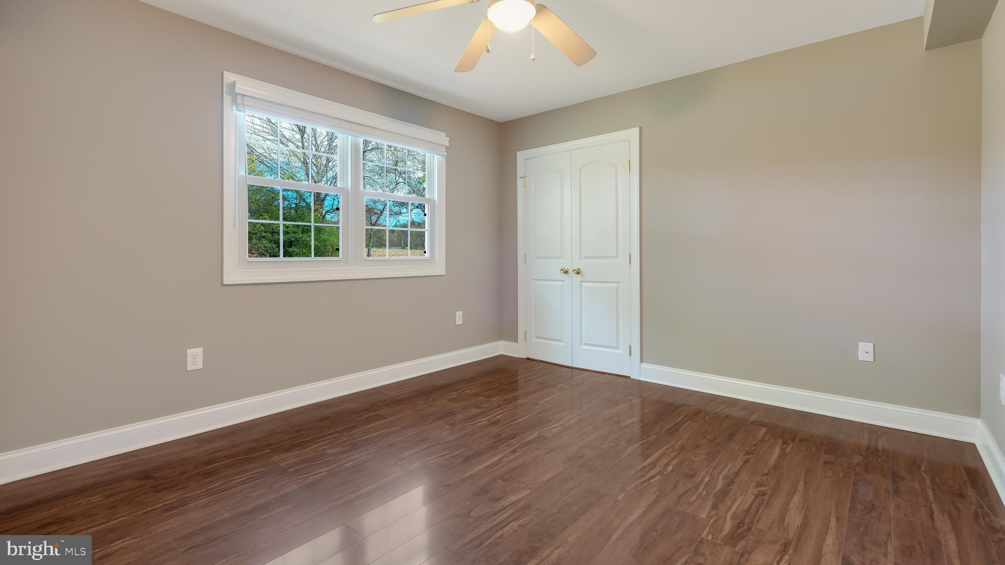 1732 Creek Road New Hope, PA 18938 - Photo 21 of 42 an empty room with wooden floor and windows
