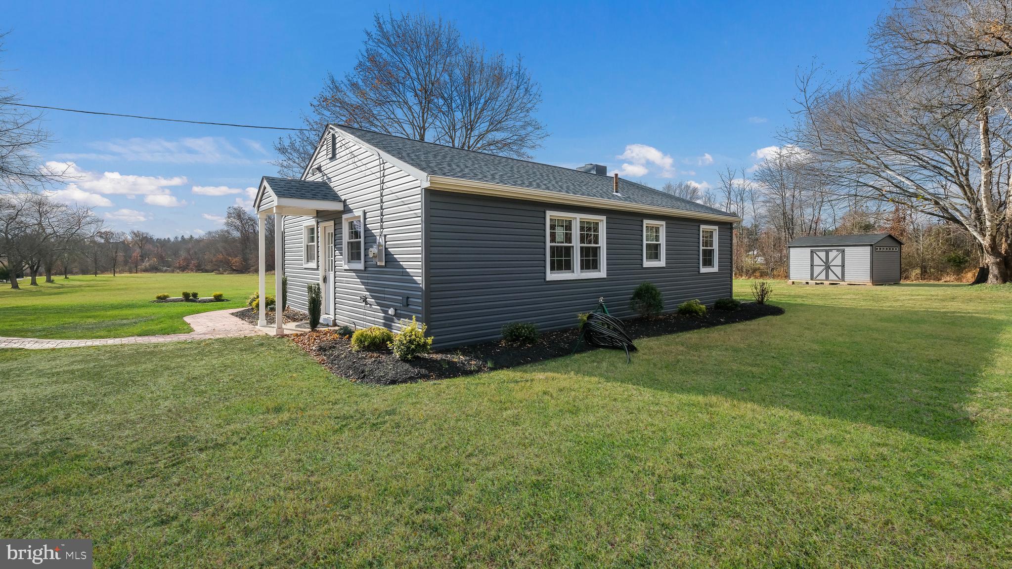 1732 Creek Road New Hope, PA 18938 - Photo 40 of 42 a backyard of a house with a garden and barbeque oven