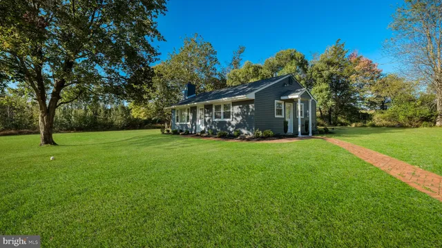 a view of house with yard