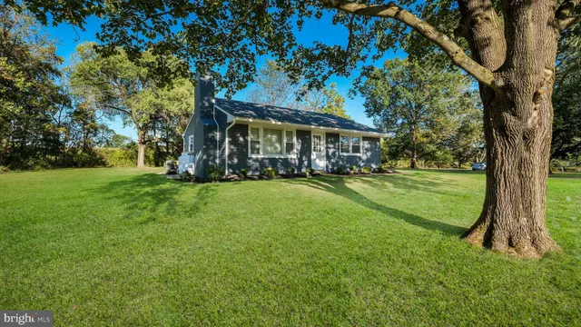 a view of a house with a big yard