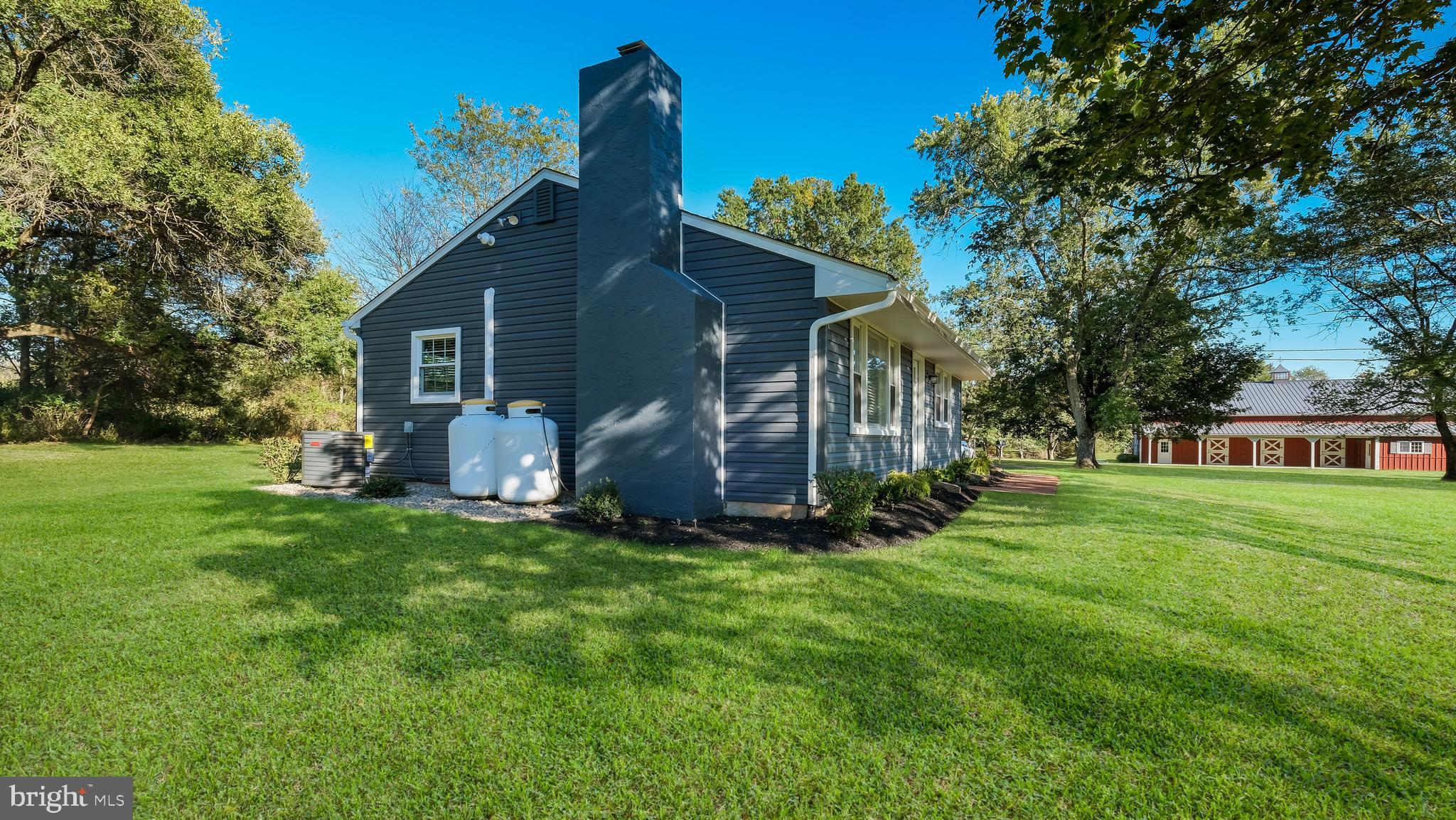 1732 Creek Road New Hope, PA 18938 - Photo 9 of 42 a view of a house with a yard and sitting area