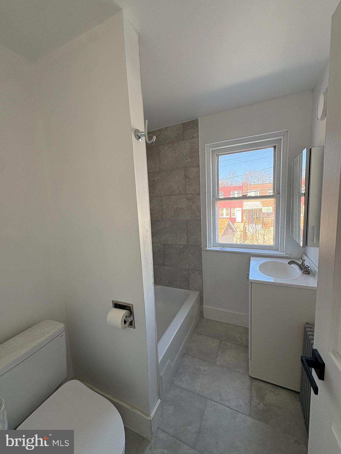 2892 North Constitution Road Camden, NJ 08104 - Photo 10 of 17 a bathroom with a toilet a sink and bathtub