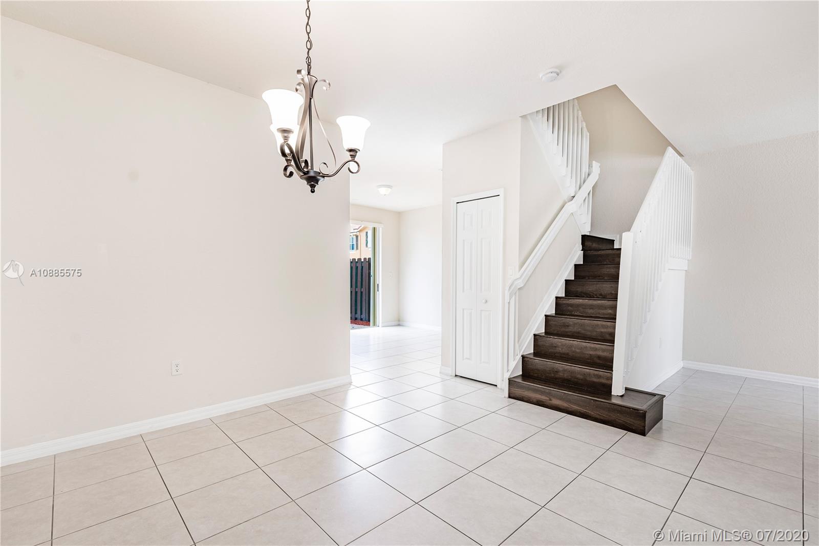 11926 Southwest 152nd Place Miami, FL 33196 - Photo 20 of 48 a view of entryway and hall with wooden floor