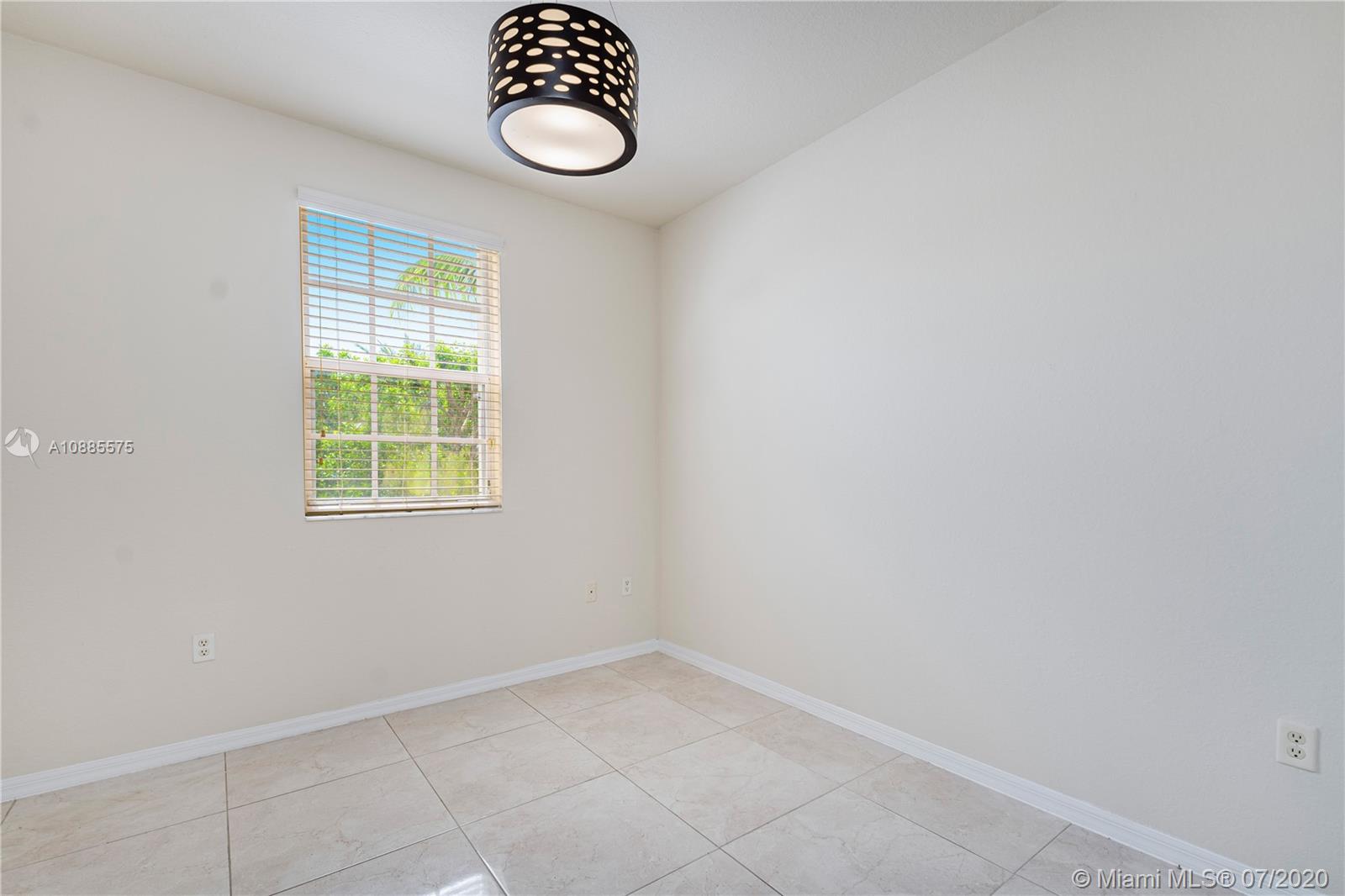 11926 Southwest 152nd Place Miami, FL 33196 - Photo 21 of 48 an empty room with a window