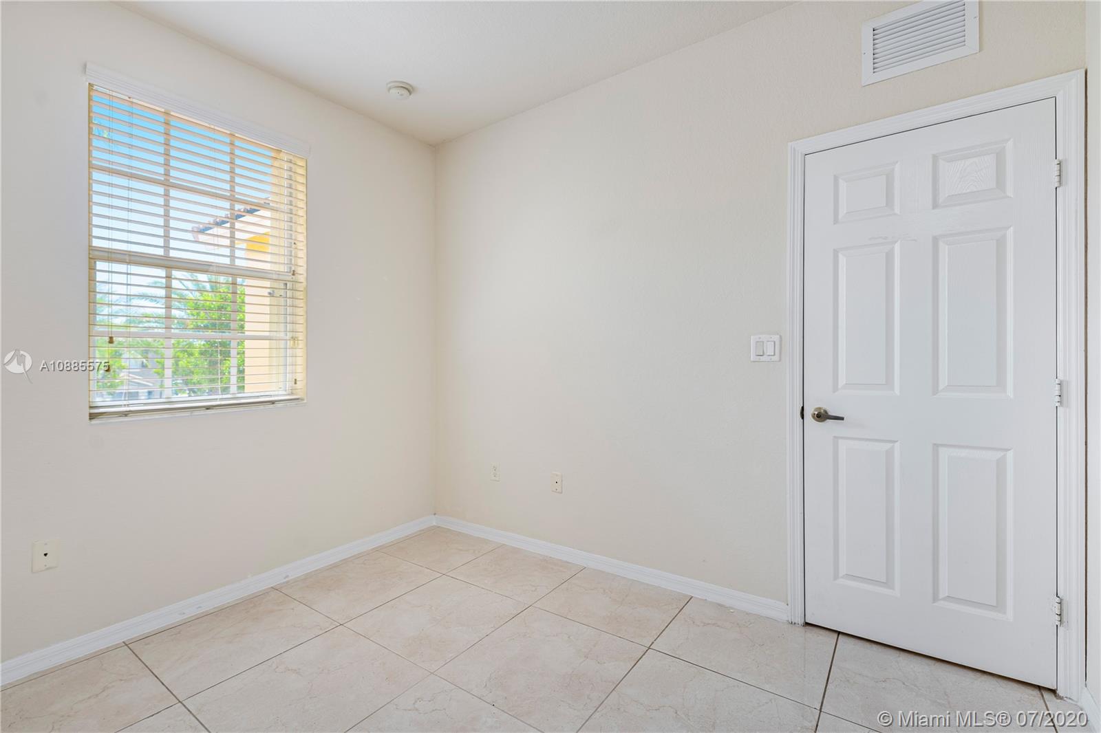 11926 Southwest 152nd Place Miami, FL 33196 - Photo 24 of 48 an empty room with windows