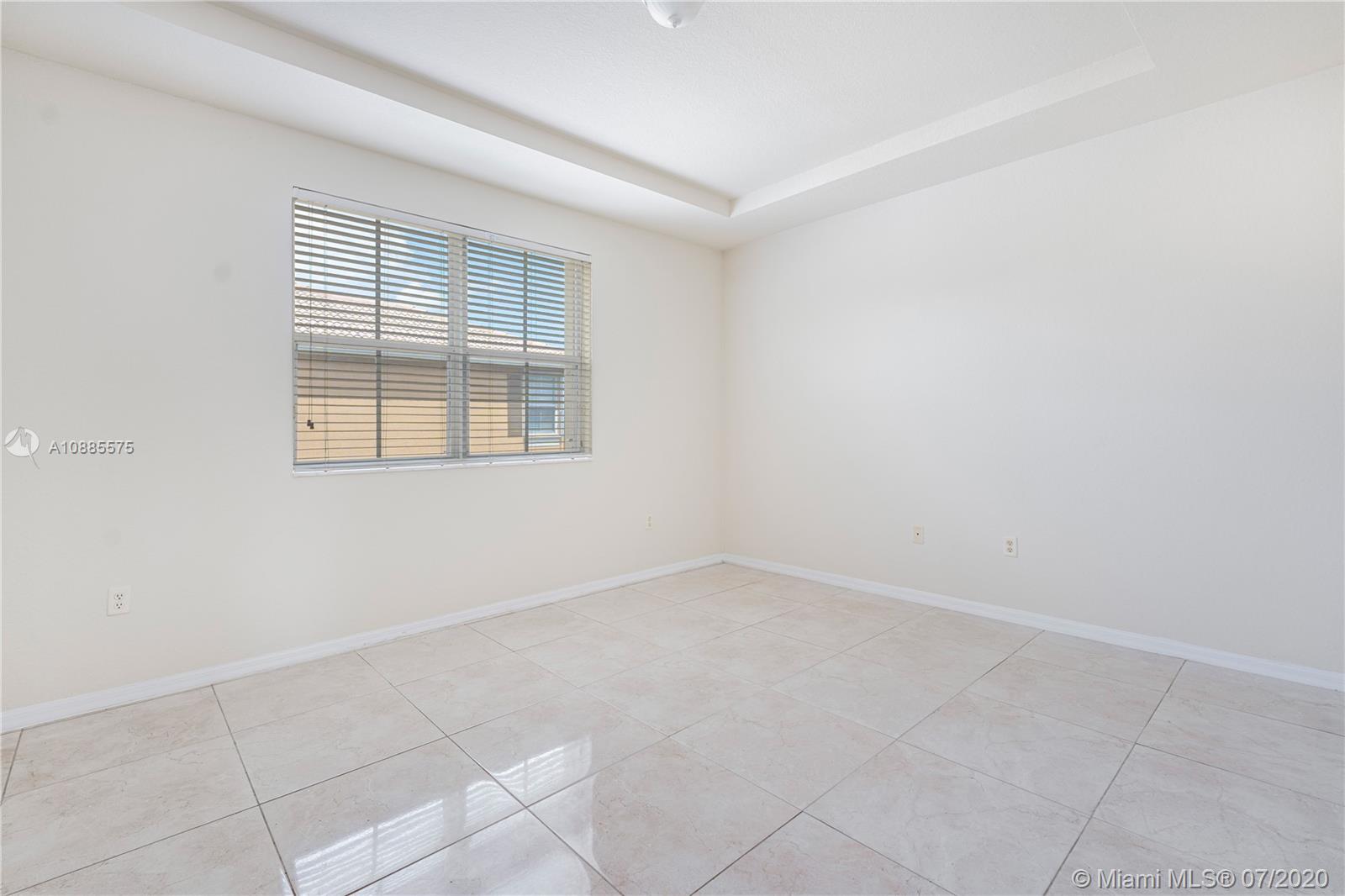 11926 Southwest 152nd Place Miami, FL 33196 - Photo 25 of 48 an empty room with a window