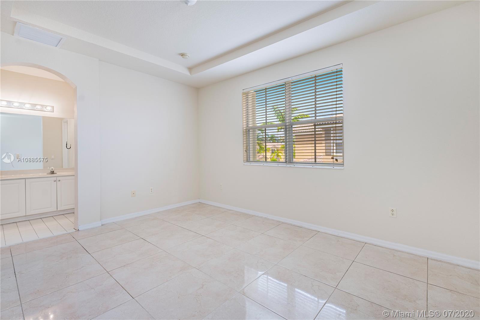 11926 Southwest 152nd Place Miami, FL 33196 - Photo 26 of 48 a view of an empty room with a window