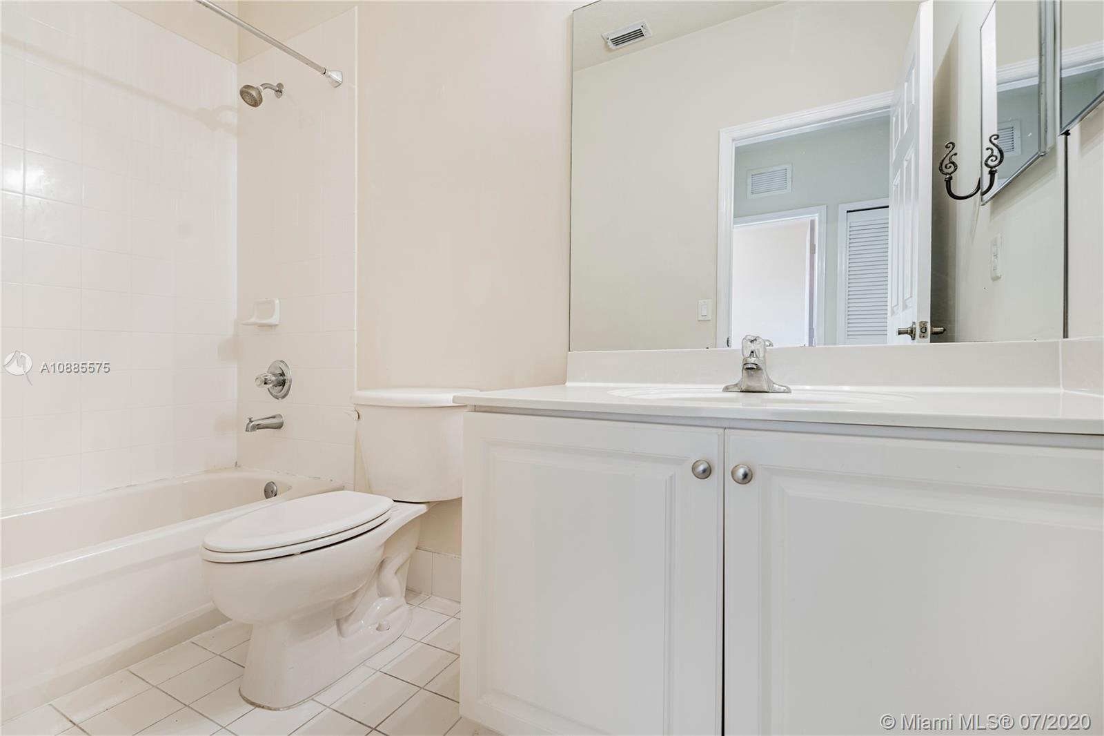 11926 Southwest 152nd Place Miami, FL 33196 - Photo 32 of 48 a bathroom with a sink toilet and shower