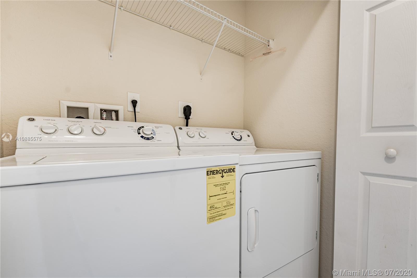 11926 Southwest 152nd Place Miami, FL 33196 - Photo 33 of 48 a utility room with dryer and washer