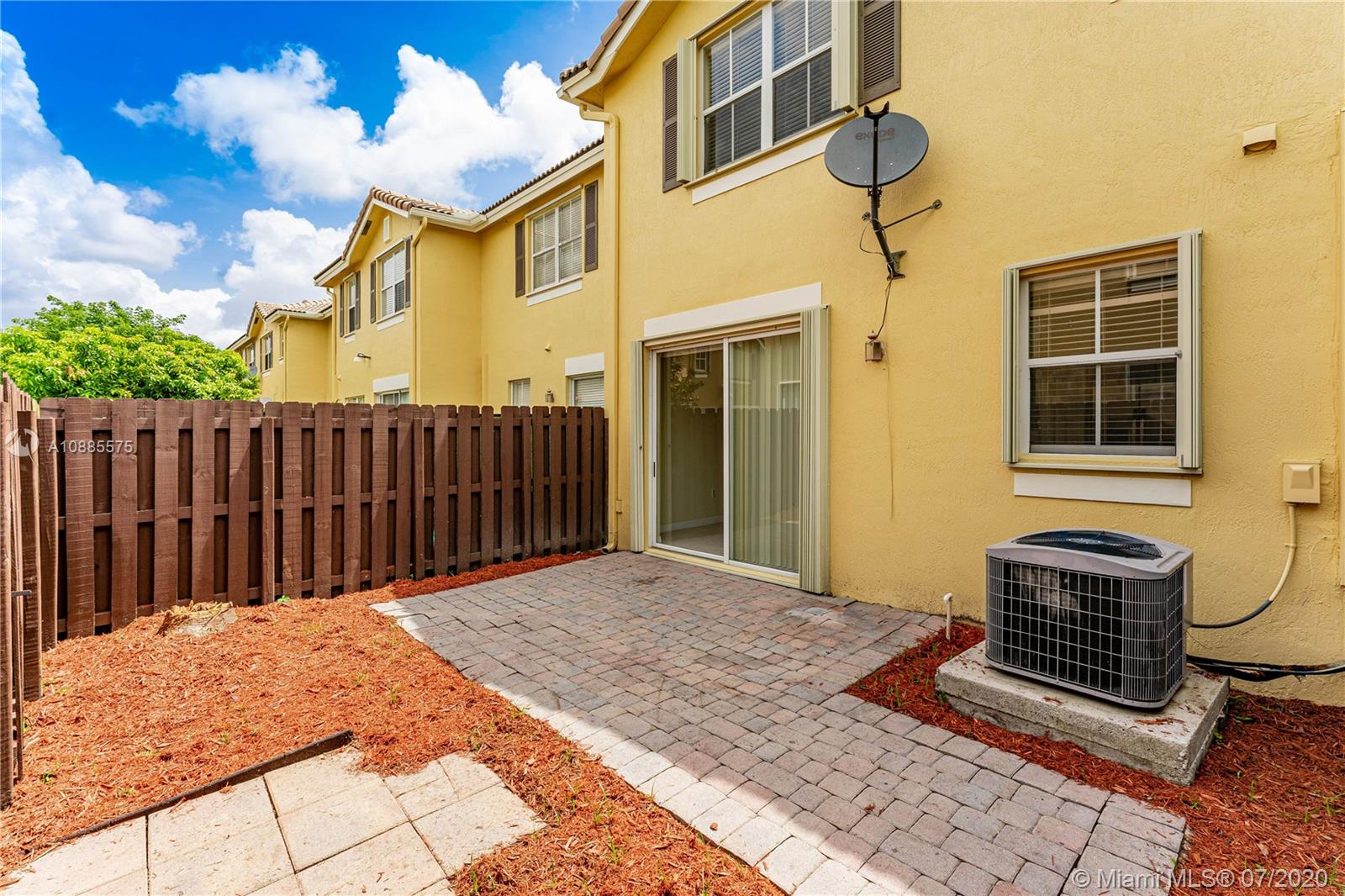 11926 Southwest 152nd Place Miami, FL 33196 - Photo 35 of 48 a view of a backyard with wooden fence