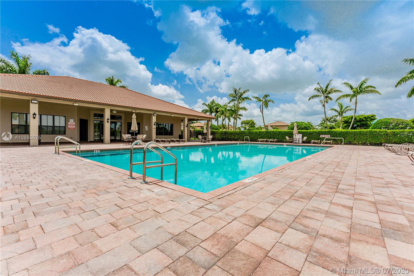 11926 Southwest 152nd Place Miami, FL 33196 - Photo 40 of 48 a view of a house with a swimming pool and a yard