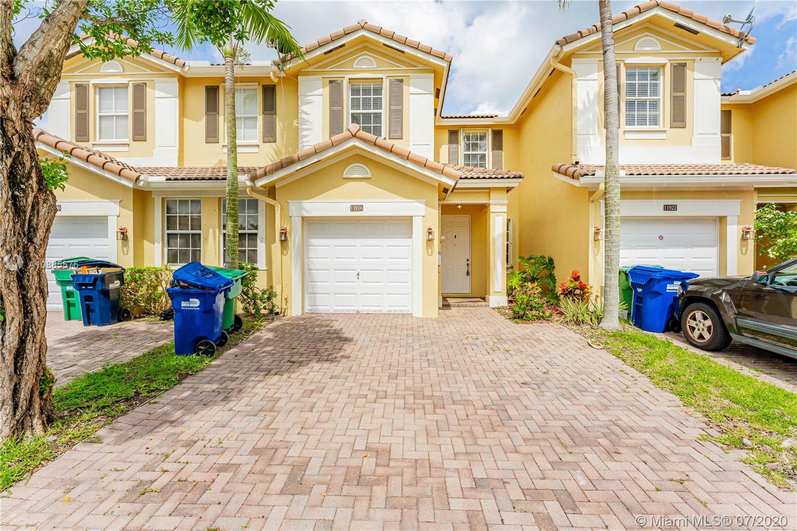11926 Southwest 152nd Place Miami, FL 33196 - Photo 4 of 48 a front view of a house with garden