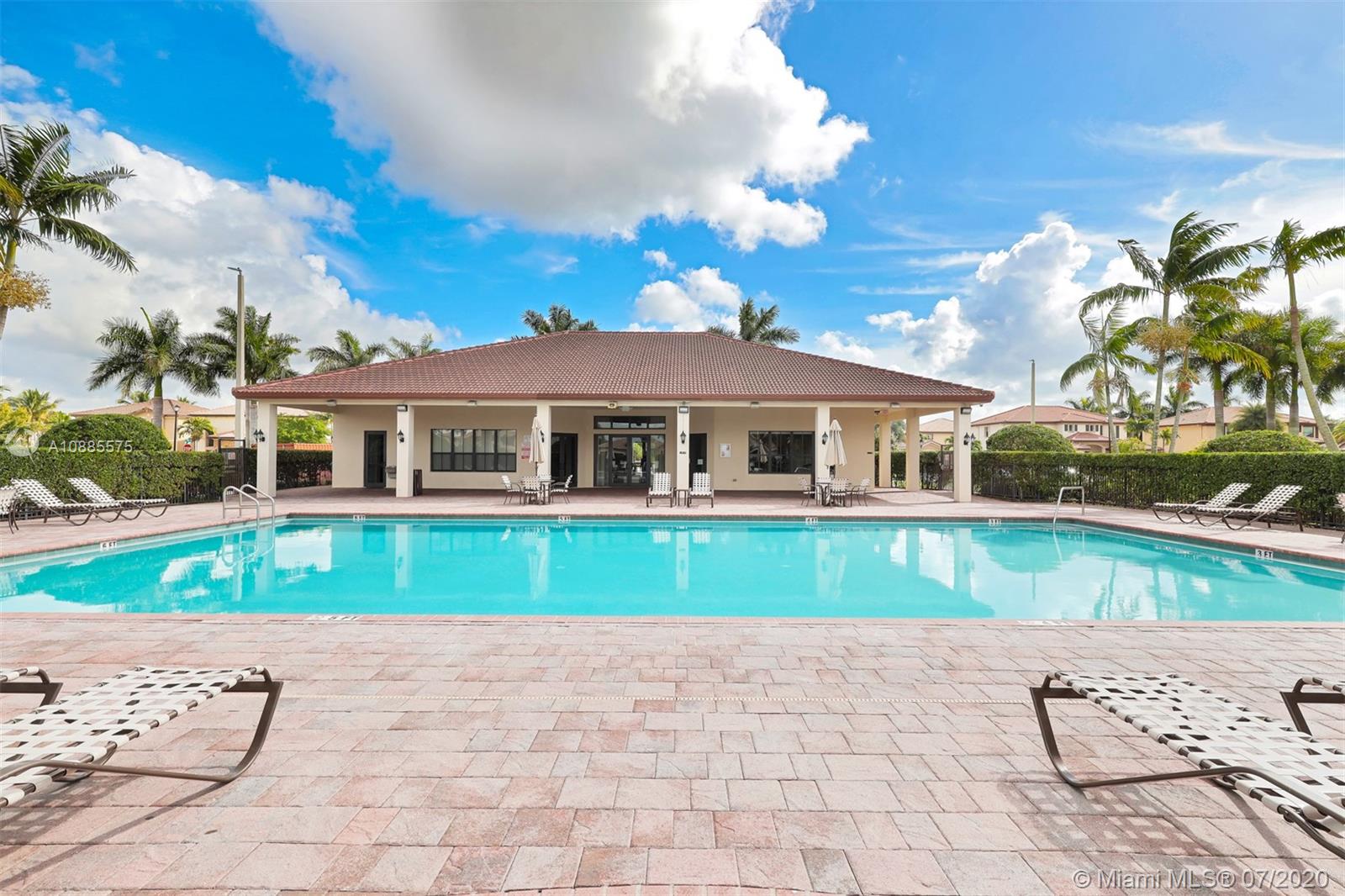 11926 Southwest 152nd Place Miami, FL 33196 - Photo 45 of 48 a front view of a house with a yard