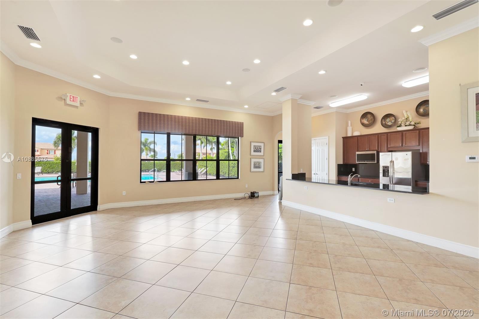 11926 Southwest 152nd Place Miami, FL 33196 - Photo 46 of 48 a view of an empty room with a fireplace and a window