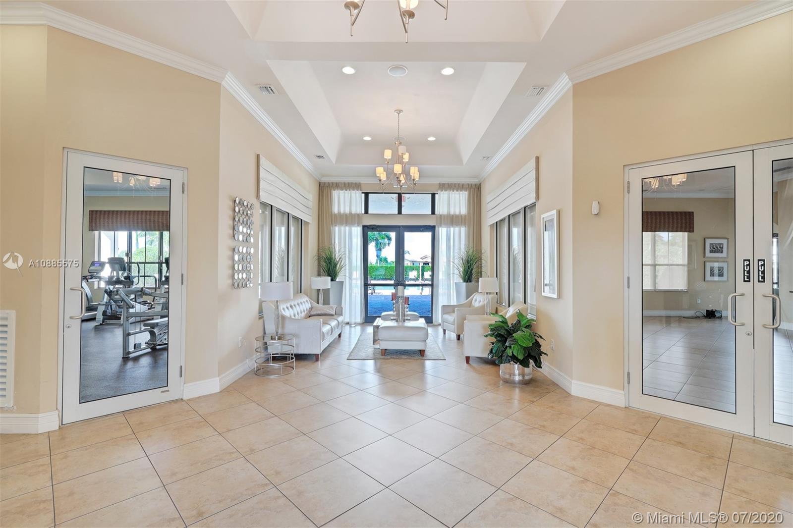11926 Southwest 152nd Place Miami, FL 33196 - Photo 47 of 48 a lobby with furniture and a chandelier