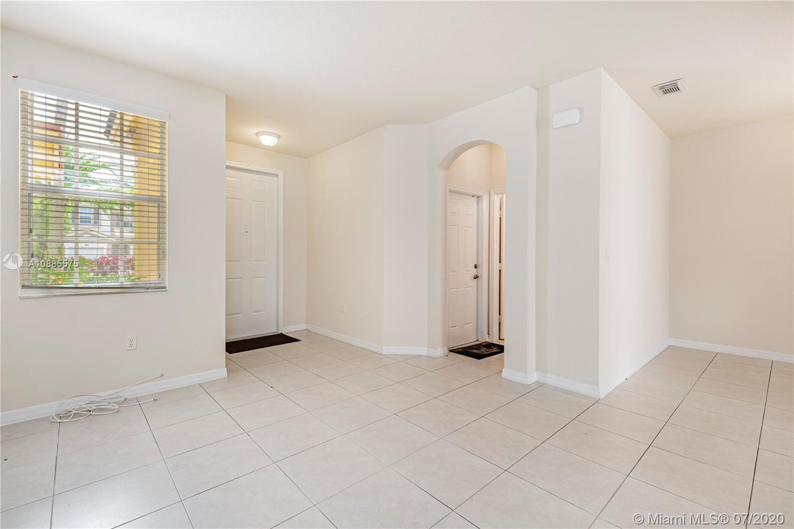 11926 Southwest 152nd Place Miami, FL 33196 - Photo 8 of 48 an empty room with windows