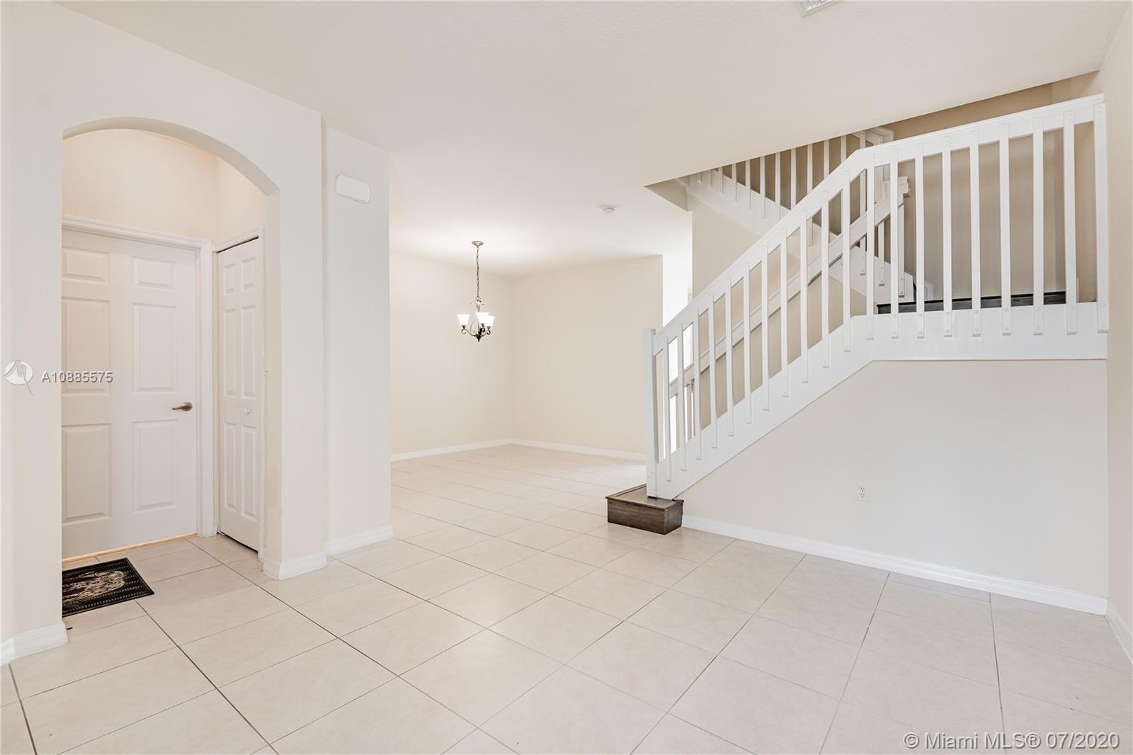 11926 Southwest 152nd Place Miami, FL 33196 - Photo 9 of 48 a view of an entryway with staircase
