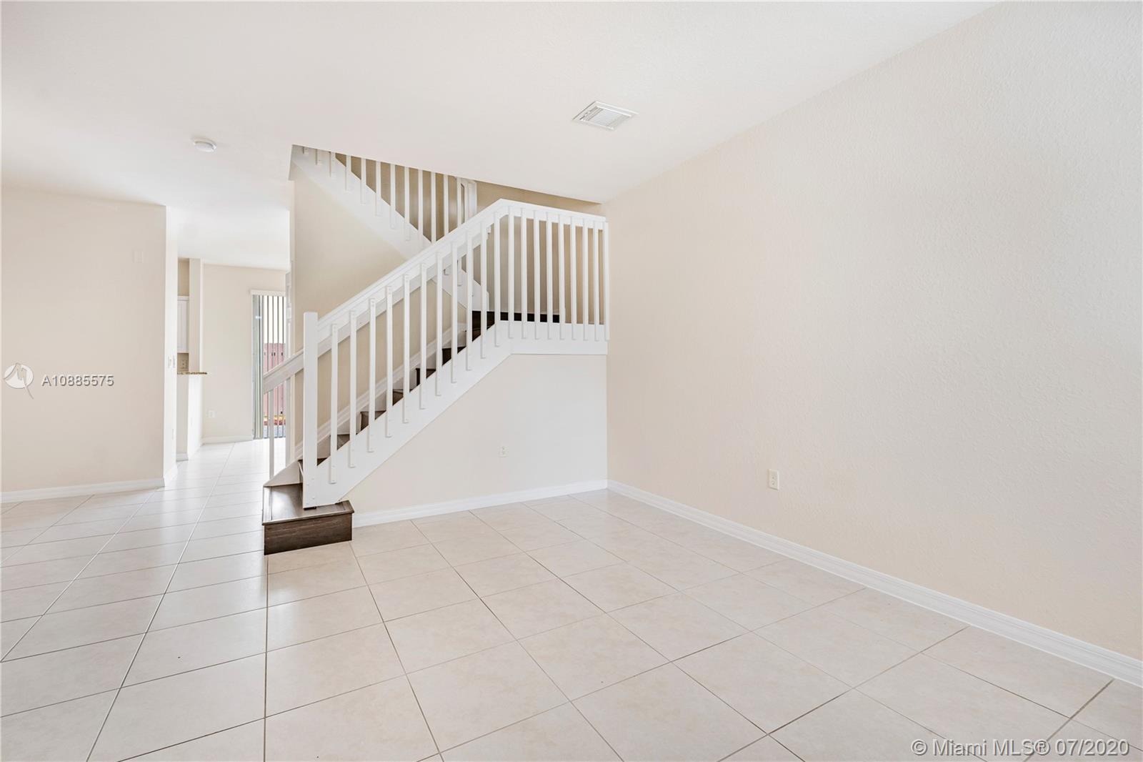 11926 Southwest 152nd Place Miami, FL 33196 - Photo 10 of 48 a view of an entryway with stairs