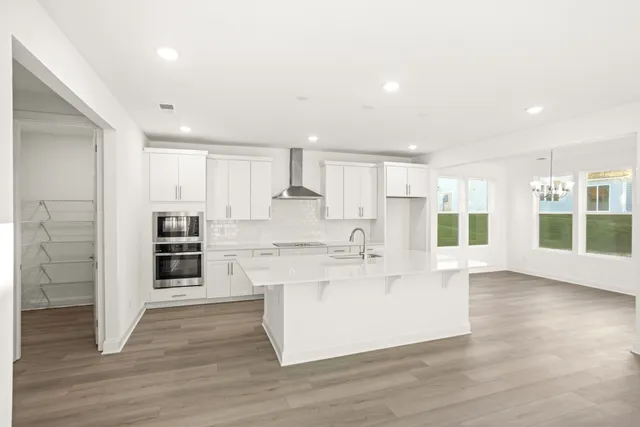 a view of cabinets with wooden floor