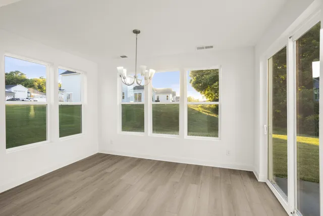 a kitchen with kitchen island a sink stove and refrigerator