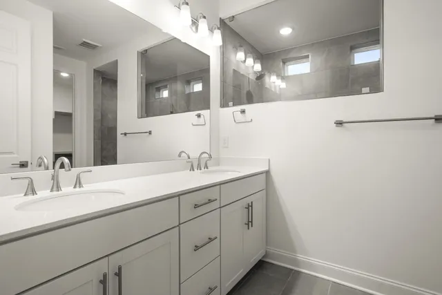 a bathroom with a glass shower door