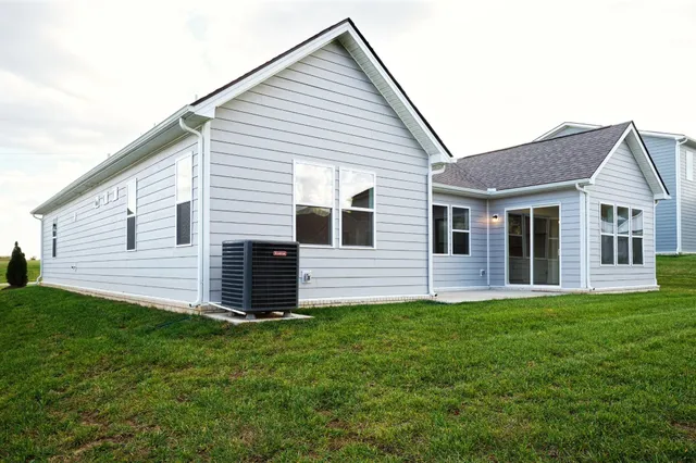 a view of a house with a backyard