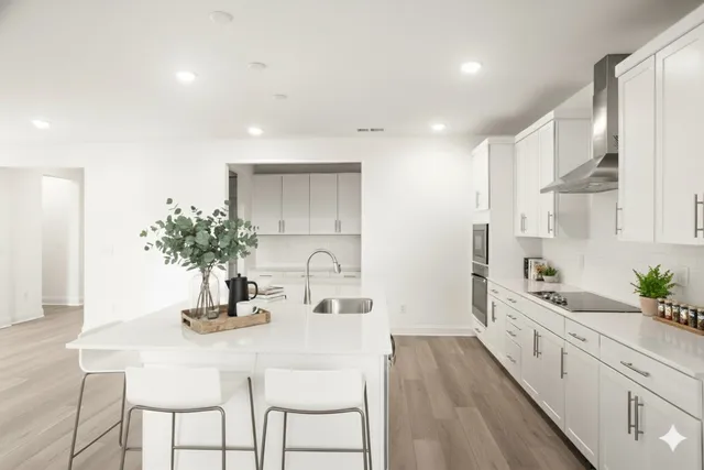 a kitchen with sink and cabinets