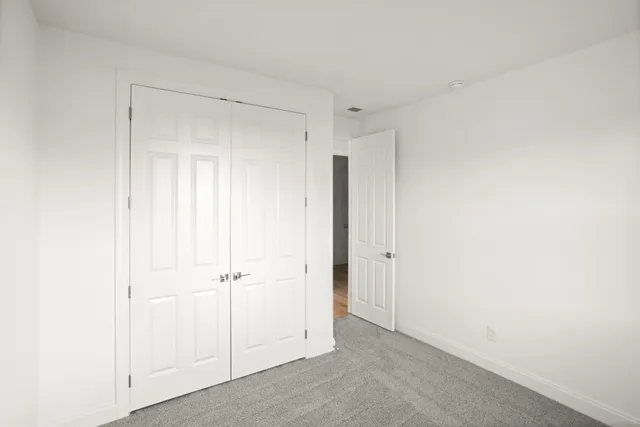 a view of kitchen with granite countertop cabinets and stainless steel appliances