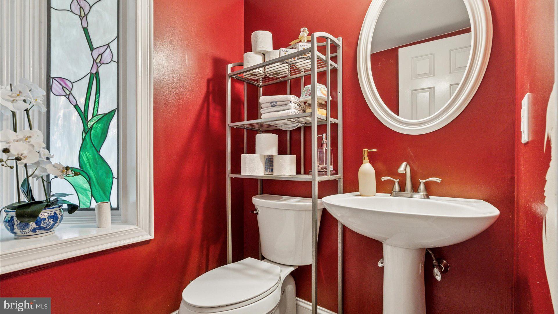 415 Fox Hollow Drive Feasterville-Trevose, PA 19053 - Photo 13 of 26 a bathroom with a toilet a sink and a mirror