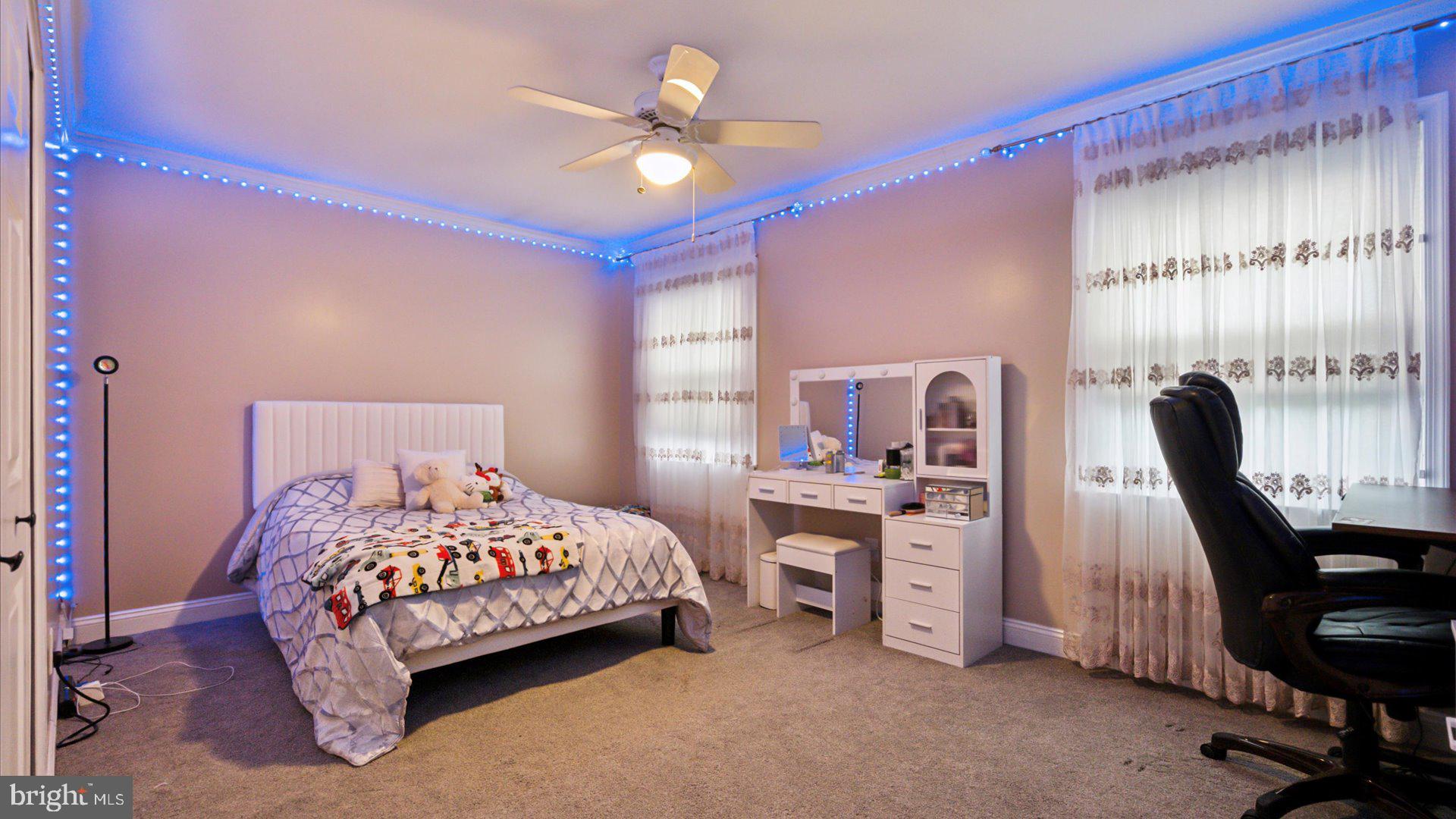 415 Fox Hollow Drive Feasterville-Trevose, PA 19053 - Photo 15 of 26 a bedroom with a bed and a desk