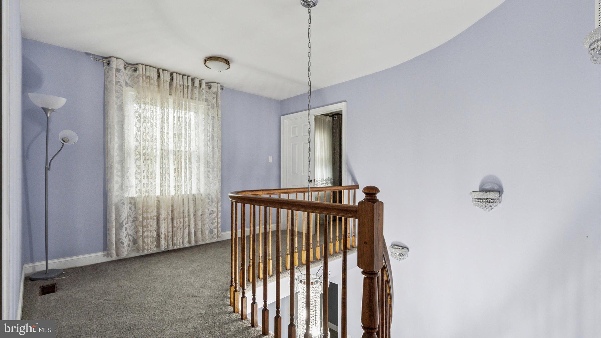 415 Fox Hollow Drive Feasterville-Trevose, PA 19053 - Photo 18 of 26 a view of a room with a mirror and stairs