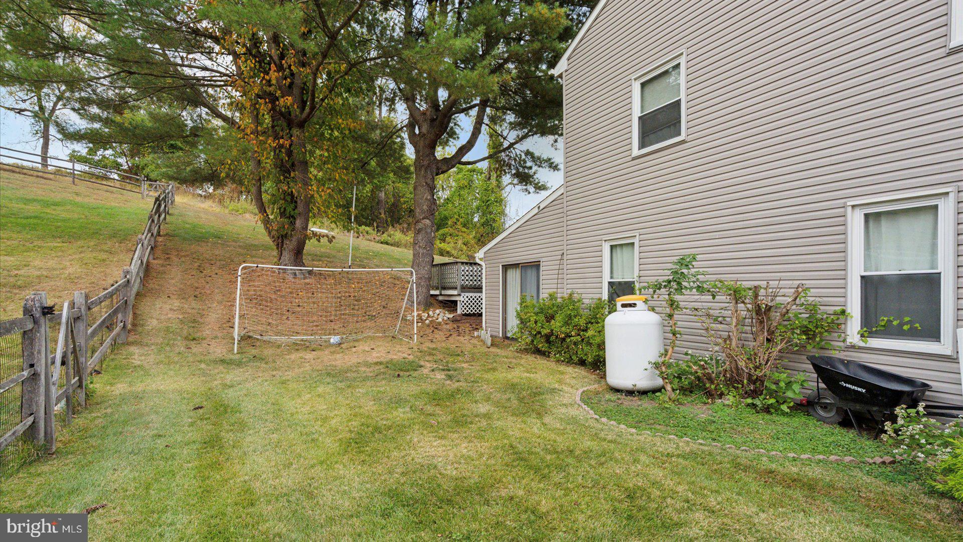 415 Fox Hollow Drive Feasterville-Trevose, PA 19053 - Photo 26 of 26 a backyard of a house with table and chairs