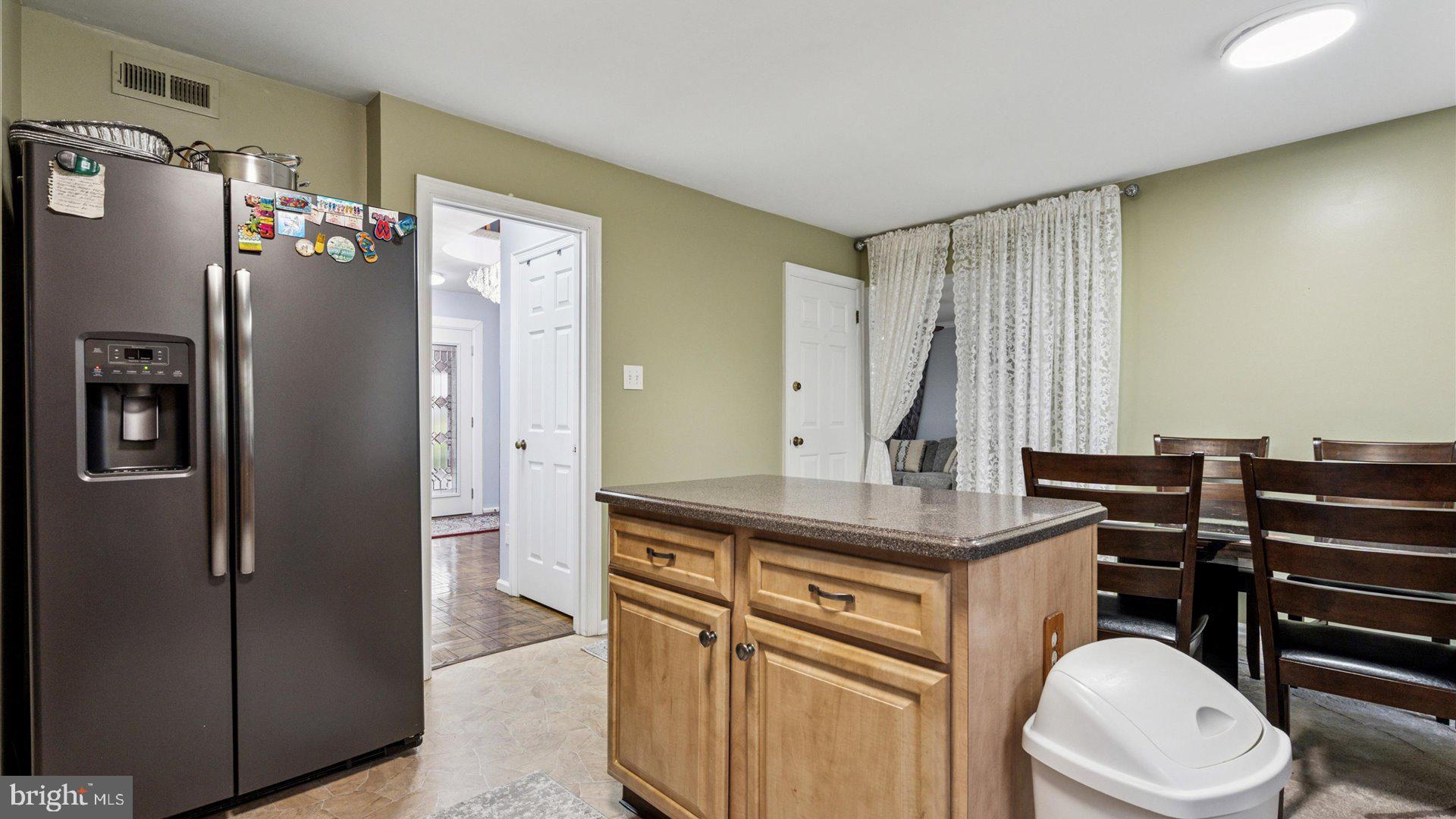 415 Fox Hollow Drive Feasterville-Trevose, PA 19053 - Photo 7 of 26 a kitchen with stainless steel appliances a refrigerator and cabinets