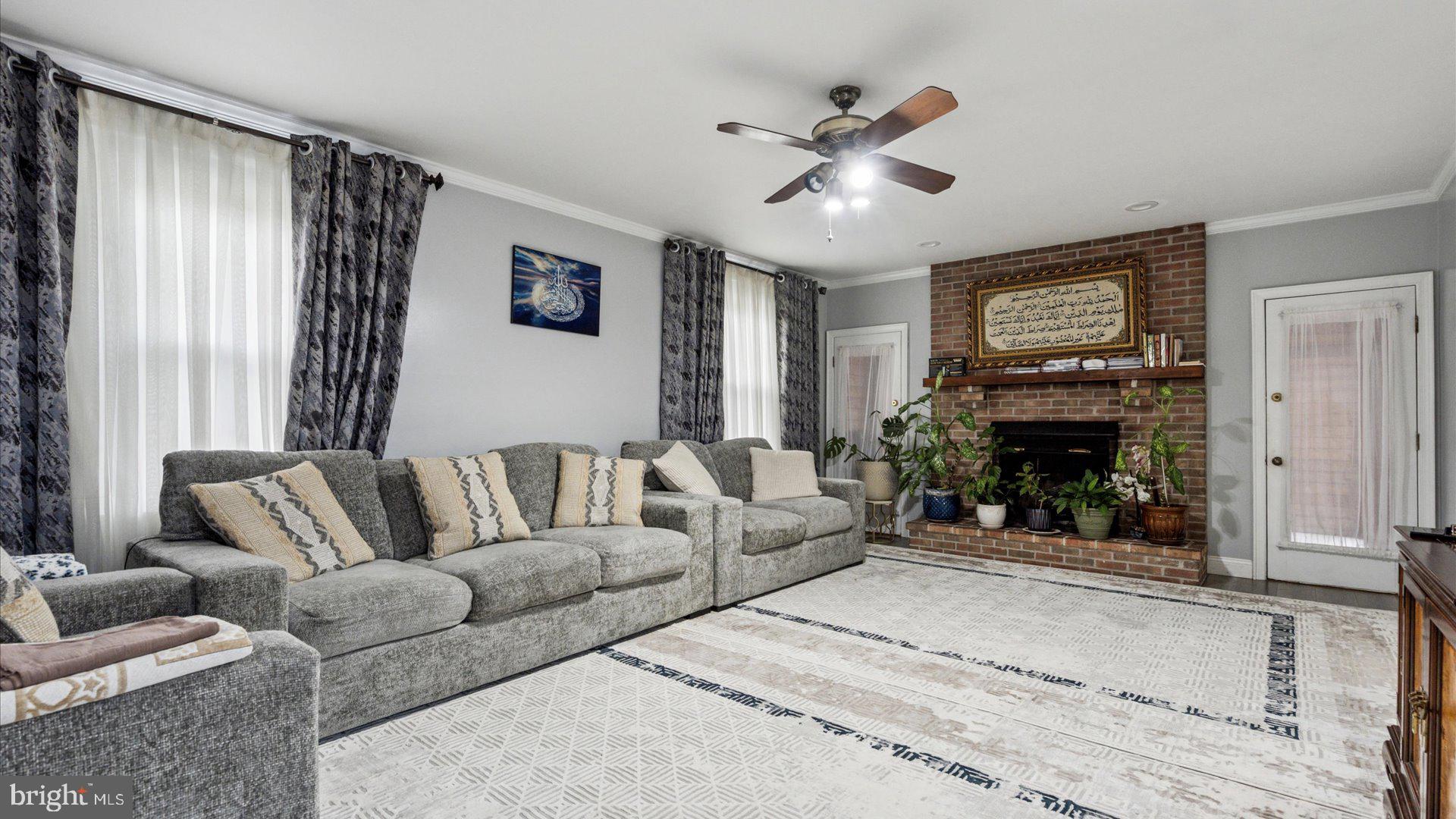 415 Fox Hollow Drive Feasterville-Trevose, PA 19053 - Photo 10 of 26 a living room with furniture and a fireplace