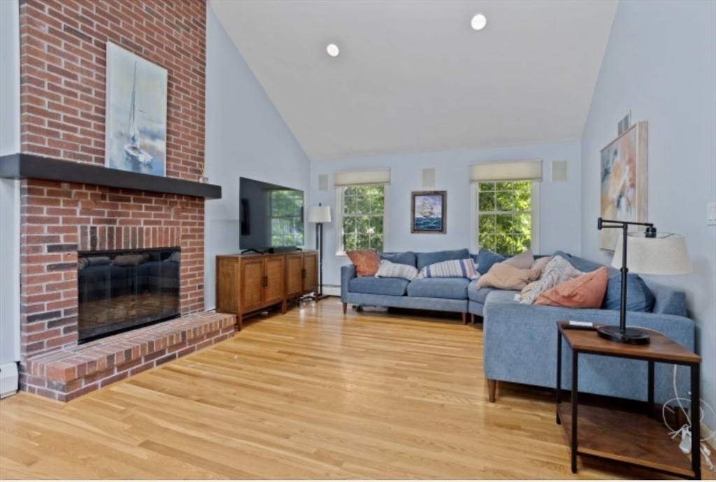 4 Kitson Park Drive Lexington, MA 02421 - Photo 12 of 38 a living room with furniture and a fireplace