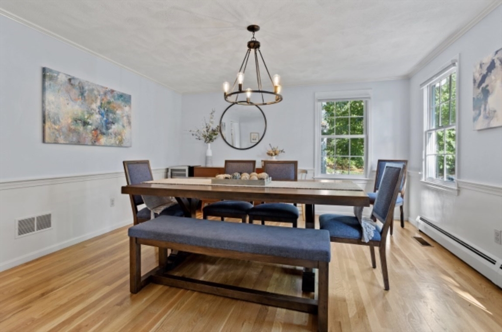 4 Kitson Park Drive Lexington, MA 02421 - Photo 18 of 38 a view of a dining room with furniture window and wooden floor