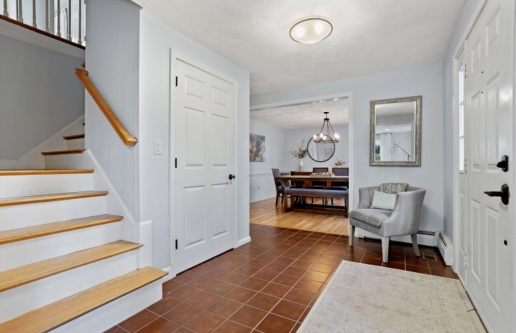 4 Kitson Park Drive Lexington, MA 02421 - Photo 19 of 38 a living room with furniture and a chair