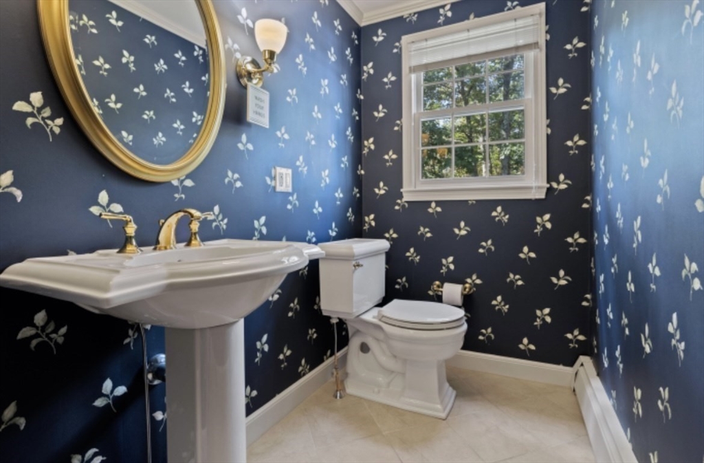 4 Kitson Park Drive Lexington, MA 02421 - Photo 20 of 38 a bathroom with a toilet a sink and mirror