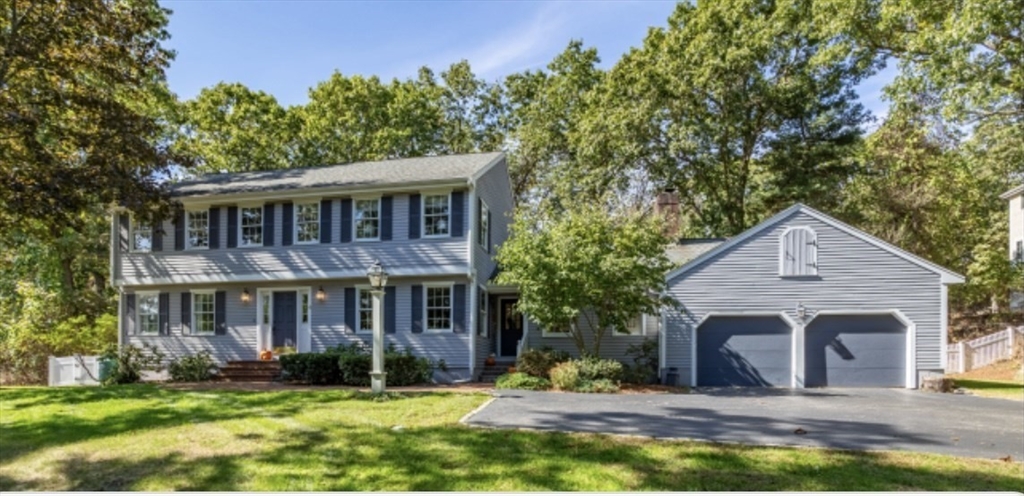 4 Kitson Park Drive Lexington, MA 02421 - Photo 2 of 38 a front view of a house with a yard