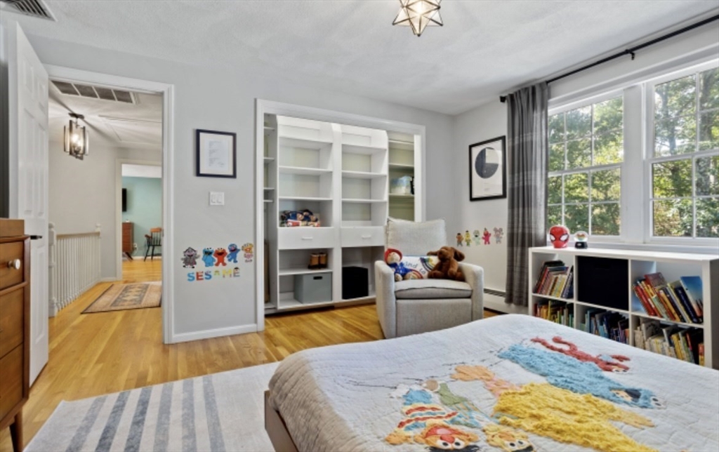 4 Kitson Park Drive Lexington, MA 02421 - Photo 27 of 38 a bed room with a bed and a view of kitchen