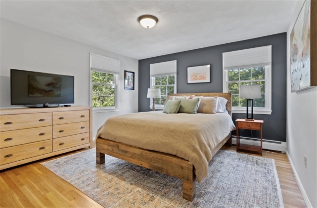 4 Kitson Park Drive Lexington, MA 02421 - Photo 29 of 38 a bedroom with a bed and a flat screen tv