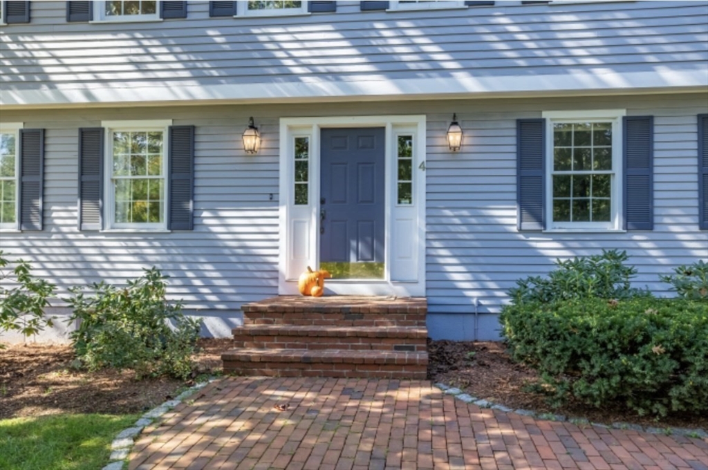 4 Kitson Park Drive Lexington, MA 02421 - Photo 31 of 38 a front view of a house with a garden