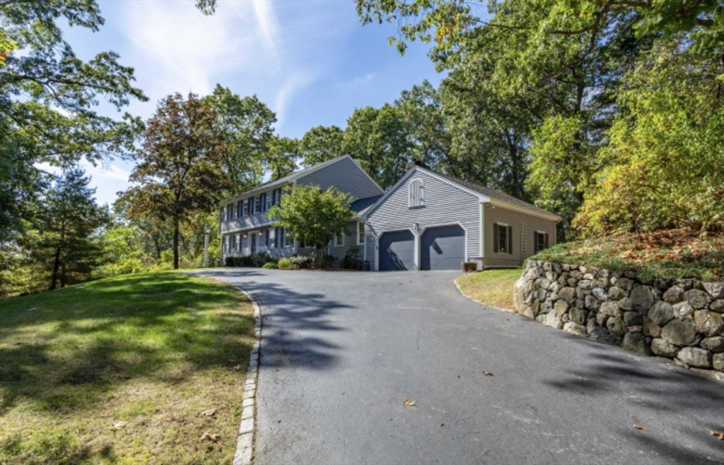 4 Kitson Park Drive Lexington, MA 02421 - Photo 4 of 38 a front view of a house with garden