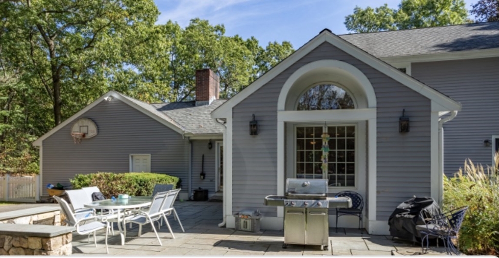 4 Kitson Park Drive Lexington, MA 02421 - Photo 5 of 38 a front view of a house with garden